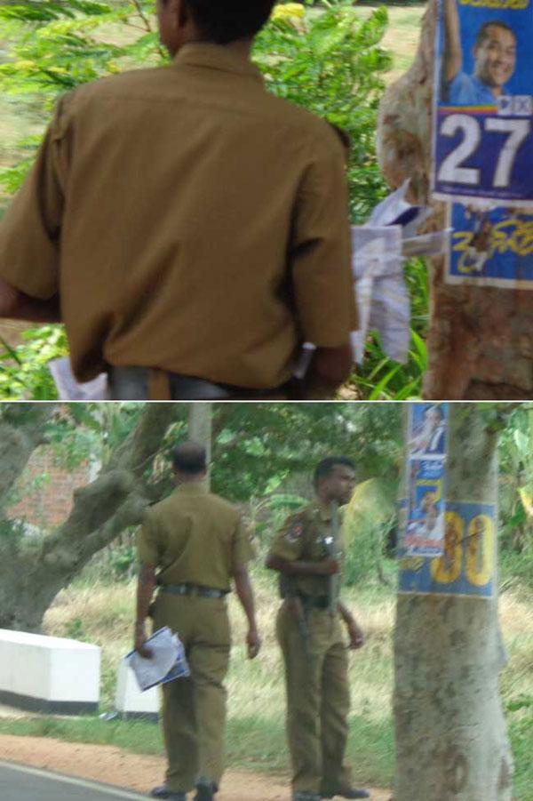 Police officers replacing Dayasiri’s posters with Johan’s - CaFFE