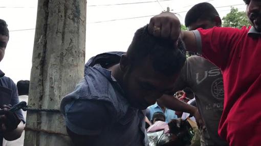 Jewelry thief tied to a lamp post before Ayyanar kovil