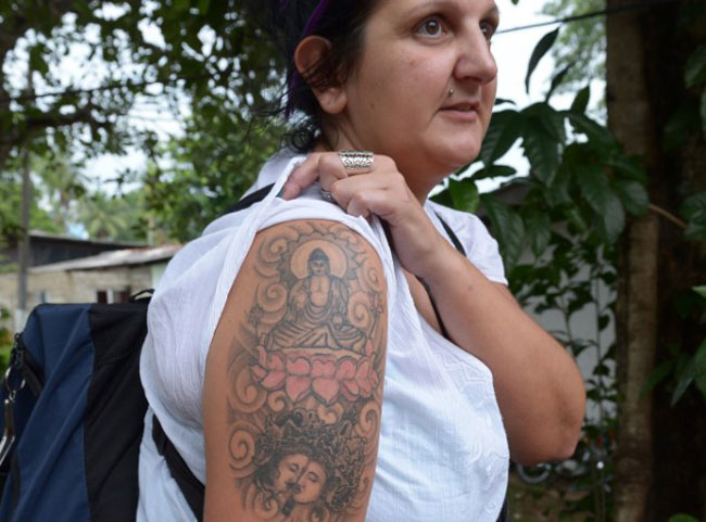 British woman arrested over ‘Buddha’ tattoo to be compensated