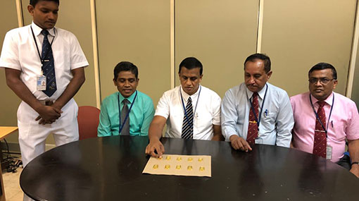 Passenger smuggling gold biscuits in rectum held at BIA