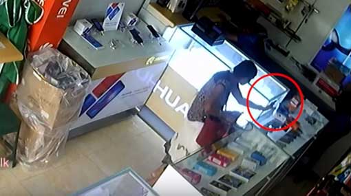 CCTV: Woman getting phone repaired steals new phone from store