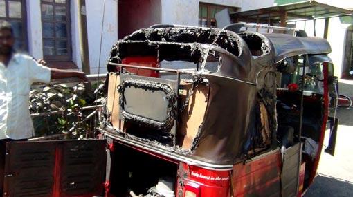 Parked three-wheeler combusts into flames