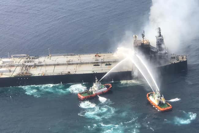Owners hand over blazing ship to international salvage company