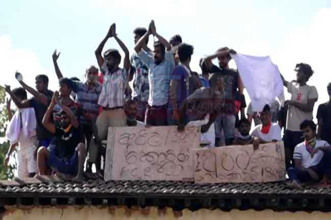 Bogambara Prison inmates protest on roof over COVID-19 fears