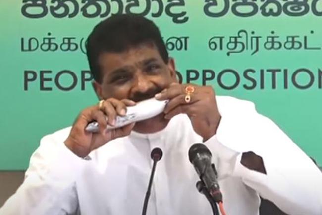 Dilip Wedaarachchi eats raw fish to shun public fear