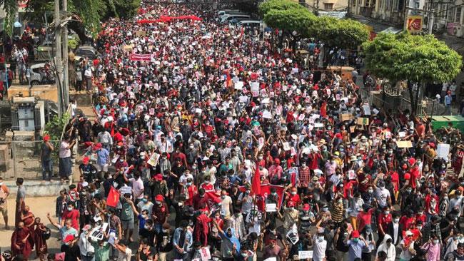 Myanmar coup: Police use water cannon as thousands strike