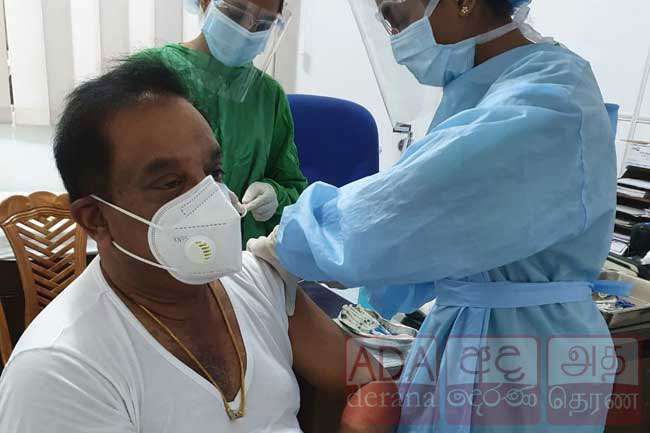 C. B. Ratnayake receives COVID-19 vaccine