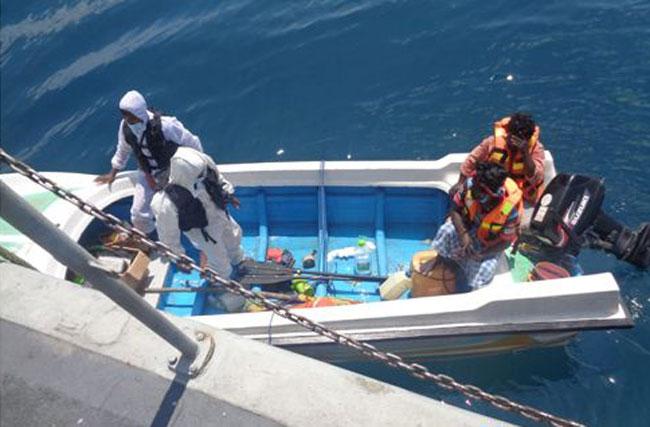 Navy rescues fishermen aboard stranded dinghy at sea