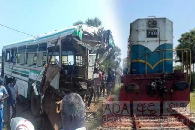 One dead, several injured as train hits bus in Talaimannar