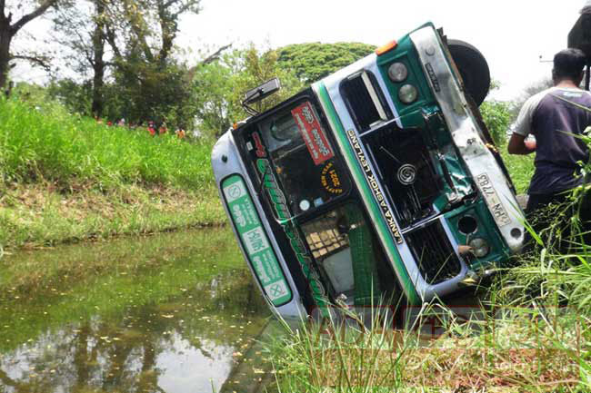 Eighteen injured as bus topples into canal