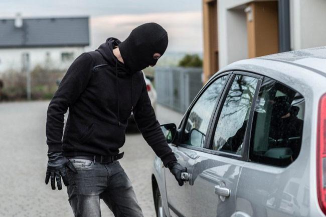 Man carjacks parked vehicle with young woman inside