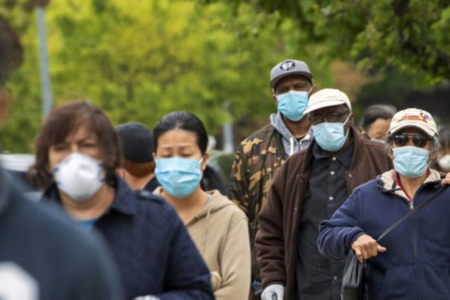 Mask wearing cuts Covid-19 risk in half, new study shows
