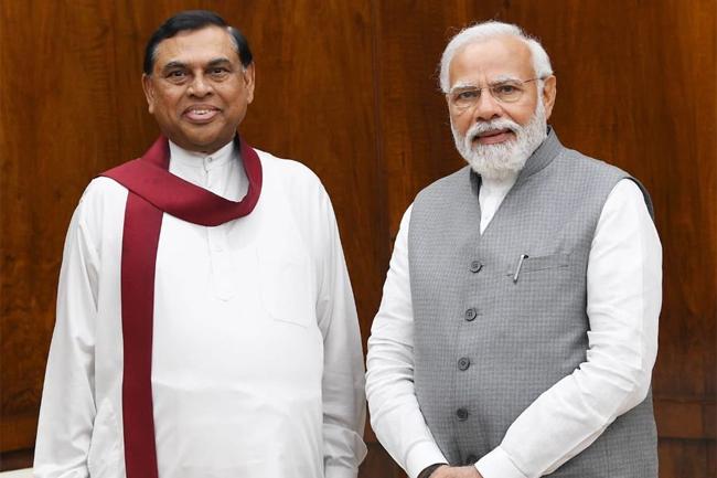 Minister Basil returns to island after India visit