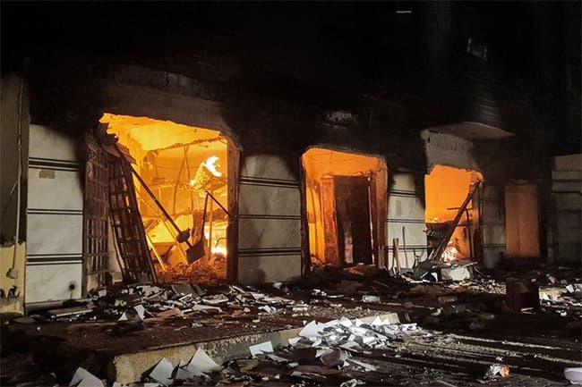 Libyan protesters storm, set fire to parliament building