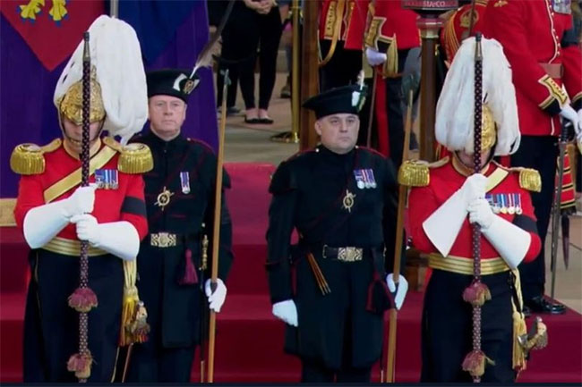UK defence minister joins ceremonial guard beside queen’s coffin