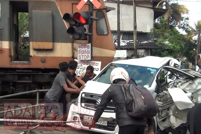 Woman critical after train collides with car at Pangiriwatta