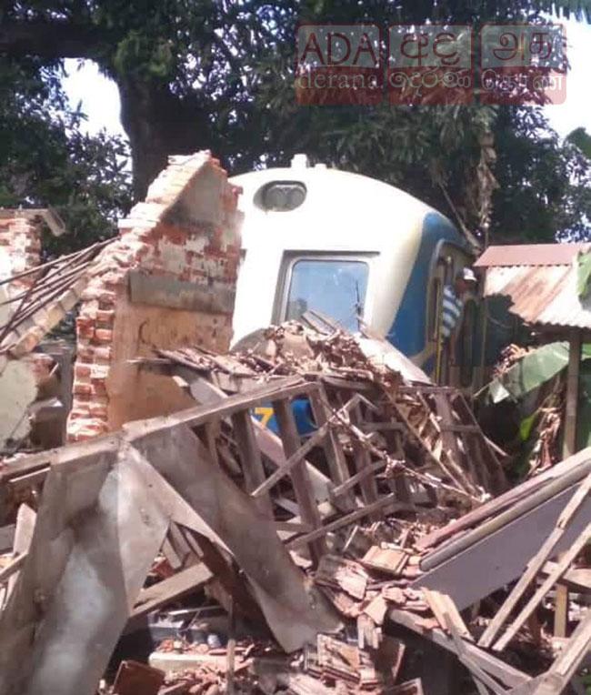 Train crashes into old building