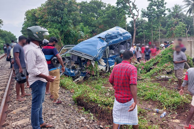 One dead, several others injured after bus collides with train