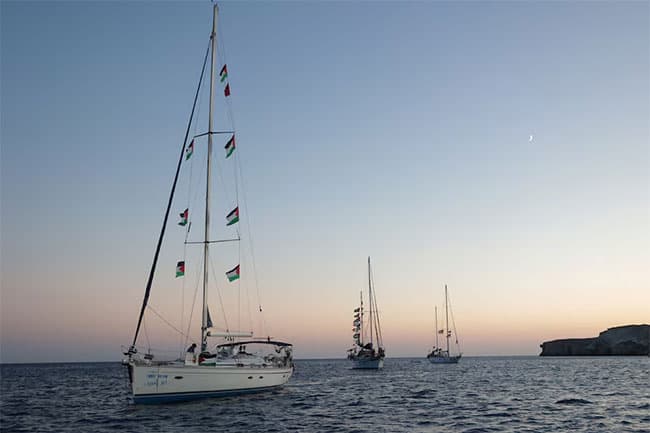 Gaza flotilla says Israeli vessels intimidated its boats as it nears blockade