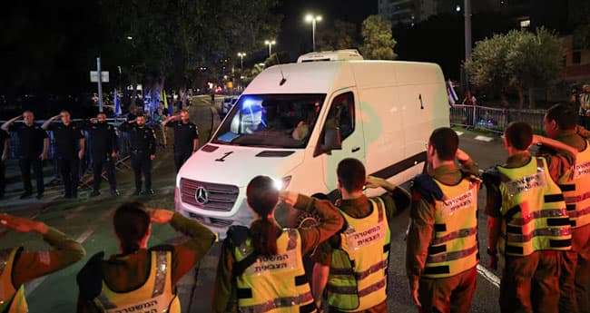 Hamas hands over hostage bodies after Israel threatens aid cut