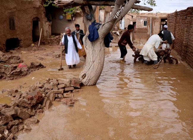 Flash floods triggered by heavy rains in Afghanistan kill at least 17 people