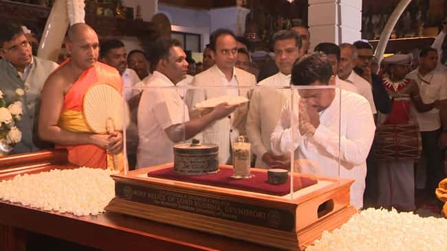 President worship Sacred Devnimori Buddha Relics brought to Gangaramaya Temple