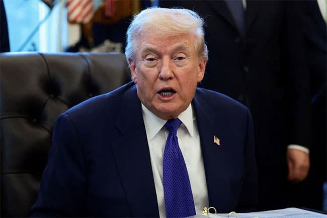 Trump signs executive order threatening tariffs for countries trading with Iran