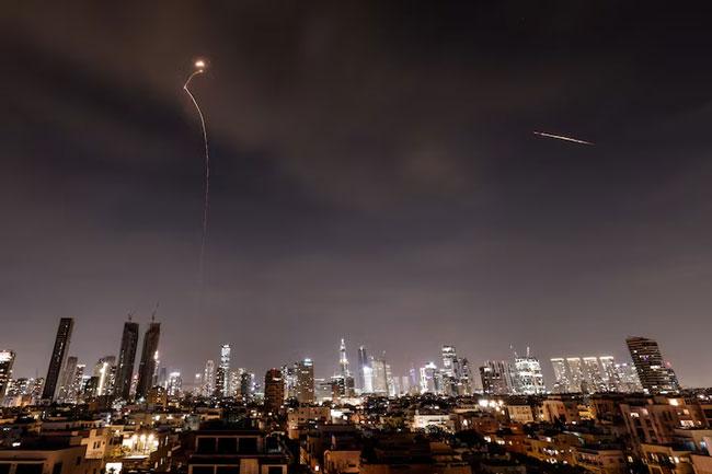Iran sends waves of missiles into Israel, dismisses Trump’s talk of negotiations as ‘fake news’