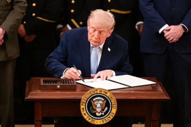 Trump’s signature to appear on US dollars in first for sitting president