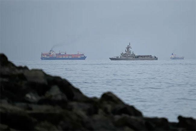 Three vessels hit by gunfire in Strait of Hormuz, crews safe