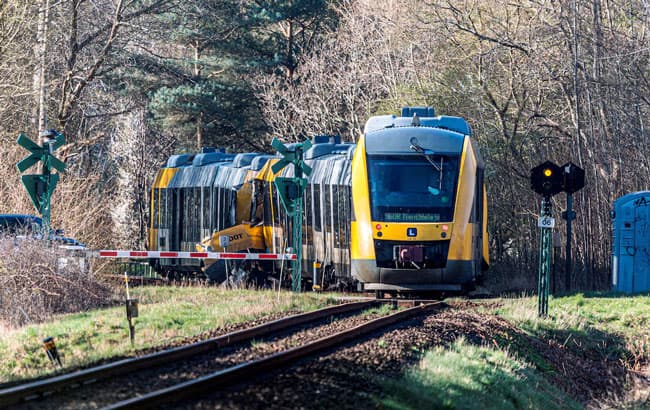 Two trains collide in Denmark, injuring 17 people, emergency service says