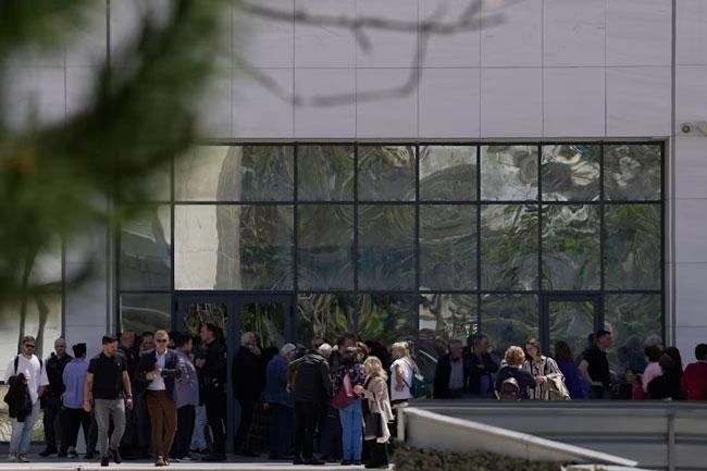 Gunman opens fire at 2 locations in the Greek capital, leaving several wounded