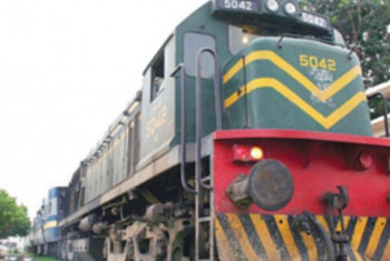 Train hits backhoe at unguarded crossing; 2 dead