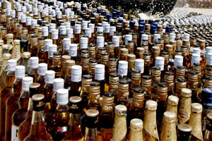 Police seize 60,000 liquor bottles in 4 lorries, 8 arrested
