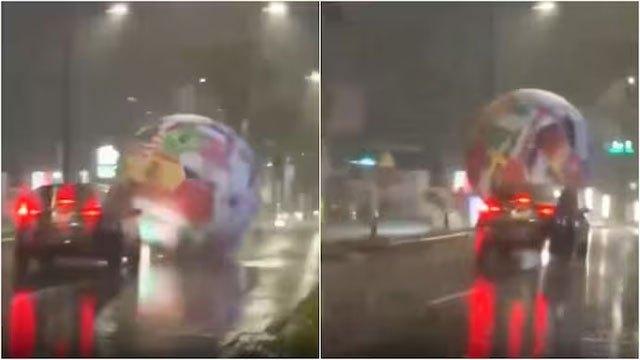 Giant football goes rogue on Central American streets during storm