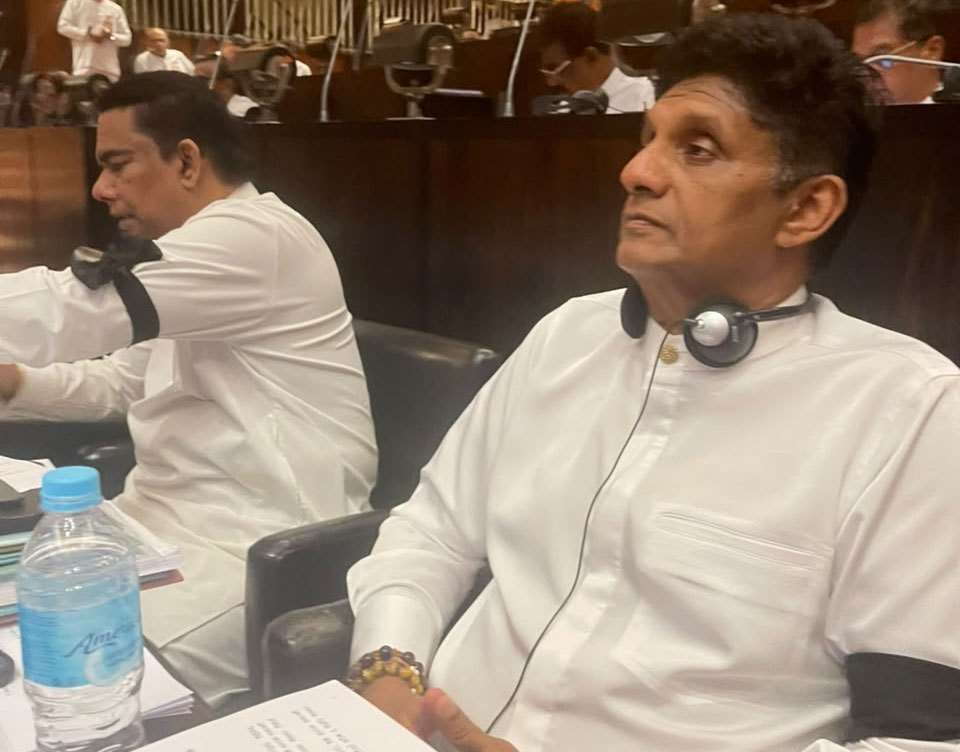 Opposition MPs protest in parliament wearing black armbands