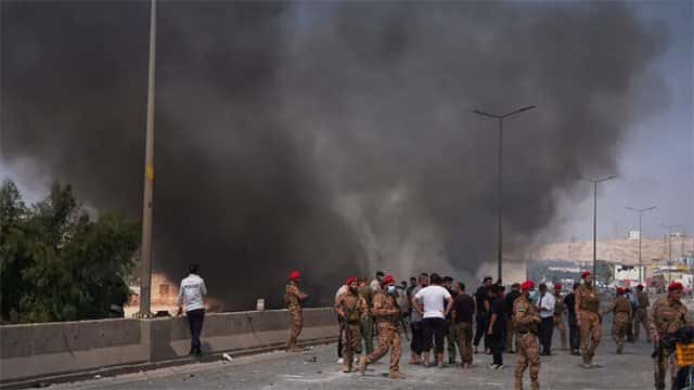 At least 14 killed in explosion at weapons depot in Syria's Idlib, state TV says