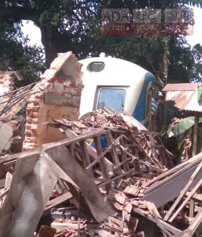 Train crashes into old building
