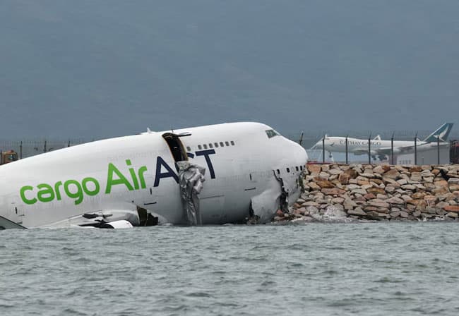 Cargo plane slides off runway in Hong Kong, media reports two dead