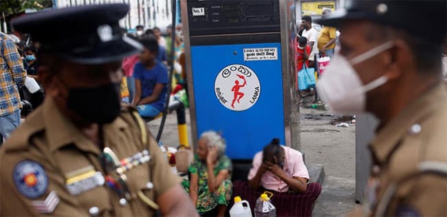 Police officers deployed to control traffic near filling stations