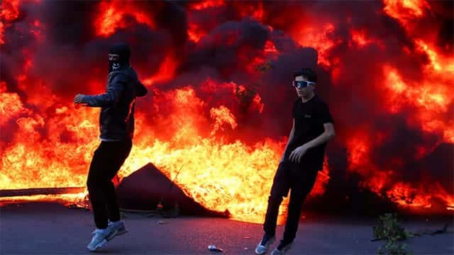 Banks, buildings burn as Albania's capital Tirana erupts into student violence
