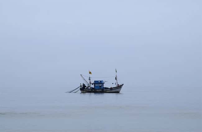 Four fishermen die after drinking from bottle found in sea; 2 survivors taken aboard merchant vessel