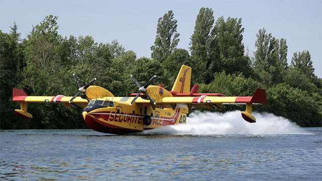 Planes scoop up water from River Seine in effort to battle wildfire near Paris