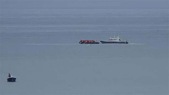 More than 150 migrants rescued after boat catches fire in English Channel