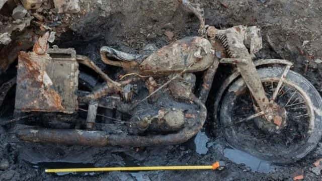 Danube river's low water levels reveal remains of WWII soldiers and motorcycle