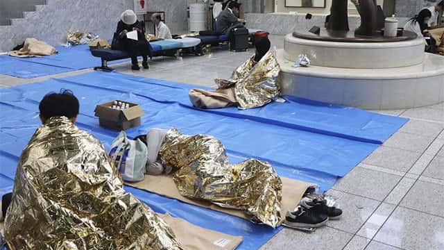 Thousands stranded at Japan's Narita airport after record rain kills four