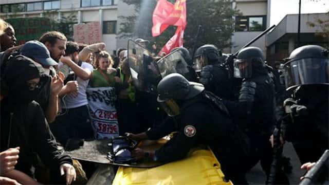 Protesters and riot police clash in cities across France